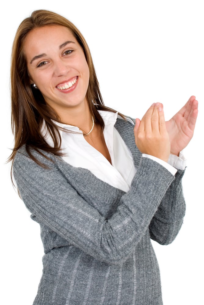 business woman applauding and smiling over a white background